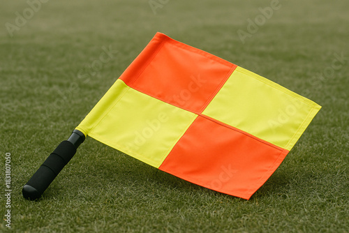 Assistant referee flag on grass