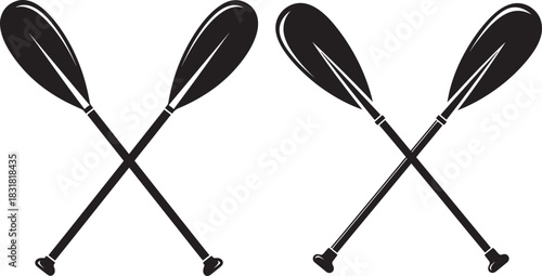 Two crossed canoe paddles silhouette