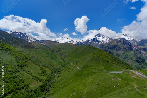 Wallpaper Mural Mount Kazbek above winding road and green Georgian valley Torontodigital.ca