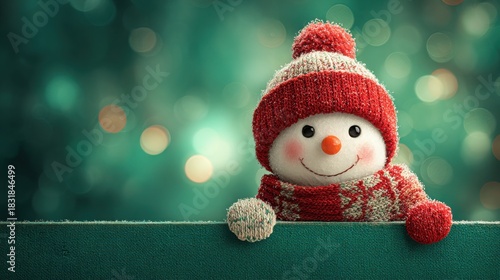 Cheerful snowman with red and white hat and scarf against a festive green background with bokeh lights to create a joyful holiday atmosphere