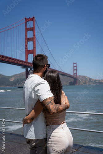 Back View of Couple Hugging by Golden Gate Bridge in San Francisco