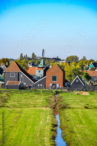 Perspective view of the Dutch polder landscape with drainage canal and traditional architecture