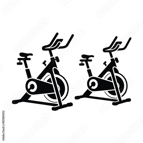 Two identical stationary bicycles are depicted side-by-side in a simplified illustration.