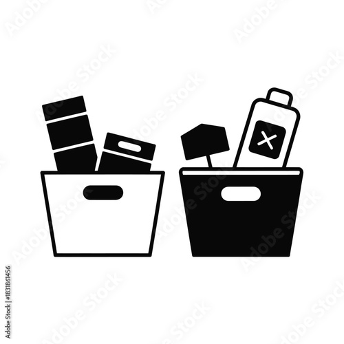Two bins filled with various items, one with a hazardous symbol.