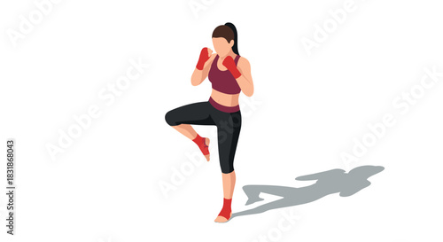 Fit woman practicing boxing moves with confident stance and shadow