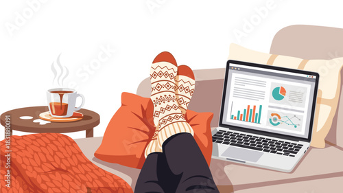 Working from home on laptop with cozy socks, warm coffee, and financial charts displayed in a relaxing, comfortable space