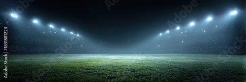 Illuminated Sports Arena: Nighttime Stadium Lights on Green Grass Background
