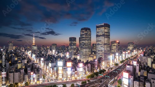 Panoramic Cityscape of Tokyo at Dusk with Vibrant Lights and Skyscrapers.