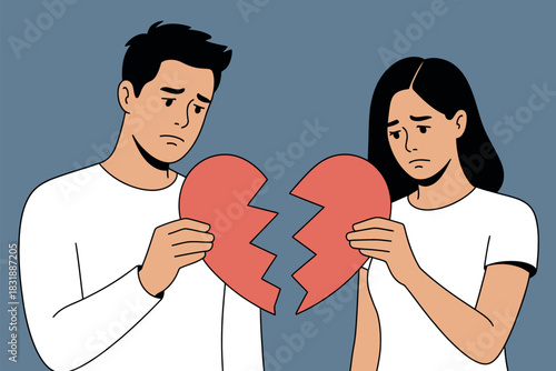A man and woman hold broken heart halves, symbolizing heartbreak and relationship separation during a sad moment.