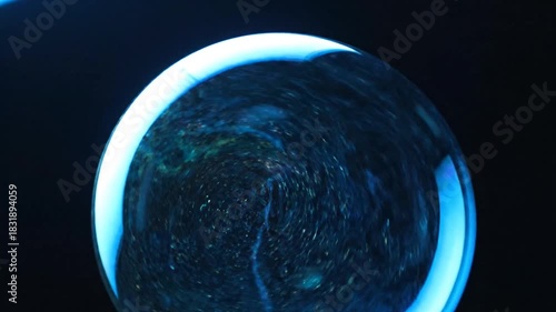 Dark Blue Sphere With Swirling Patterns And Blue Glow abstract