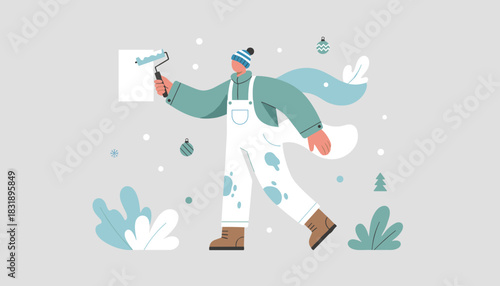 Holiday prep Person painting fresh background with roller surrounded by winter decor