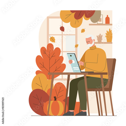 Senior man uses a tablet in a cozy autumnal setting Digital literacy fall season and remote work concept