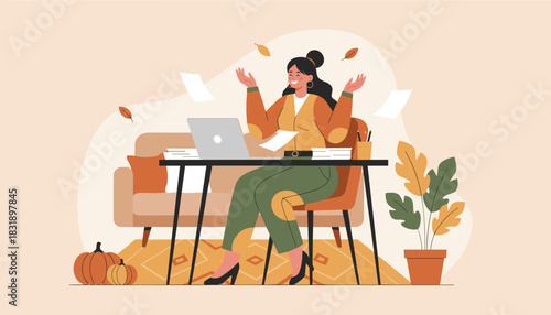 Successful woman celebrating task completion while working from her cozy autumnal home office environment