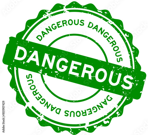 Grunge green dangerous word round rubber seal stamp on white background