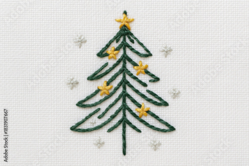 A hand-stitched Christmas tree embroidery featuring golden star accents. This festive textile art showcases delicate green threadwork for a charming holiday look.
