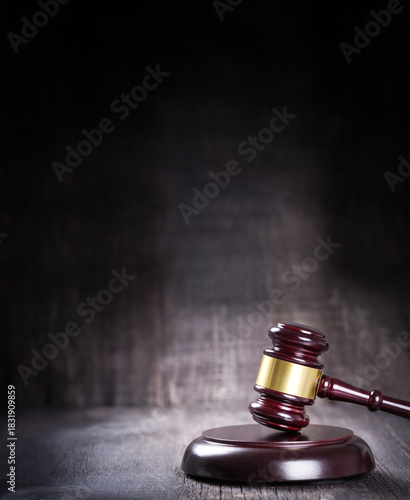 Wooden judge gavel closeup on rustic background with copy space
