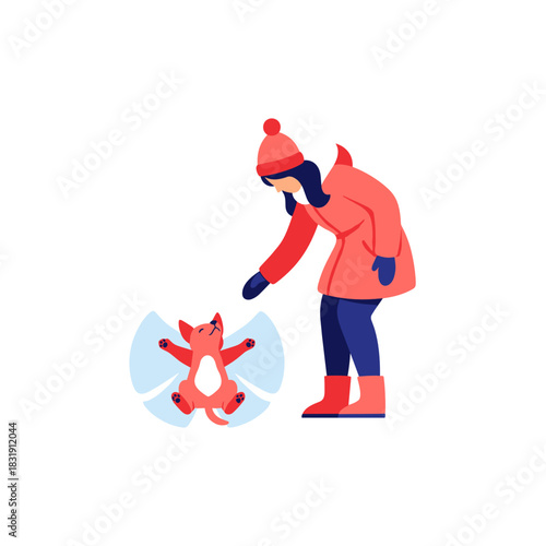 Woman teaching her small dog to make a snow angel in winter  