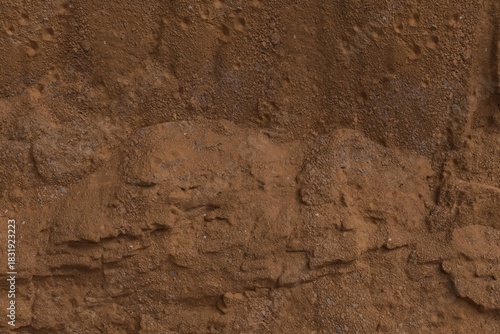 Fotografie Close-up of a textured, layered reddish-brown earth/rock formation