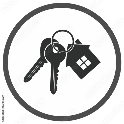 Monochrome image of two keys and a house key chain representing real estate property