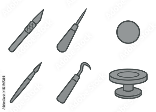 Essential pottery tools: sculpting knives, loop tools, and trimming supplies on dark background