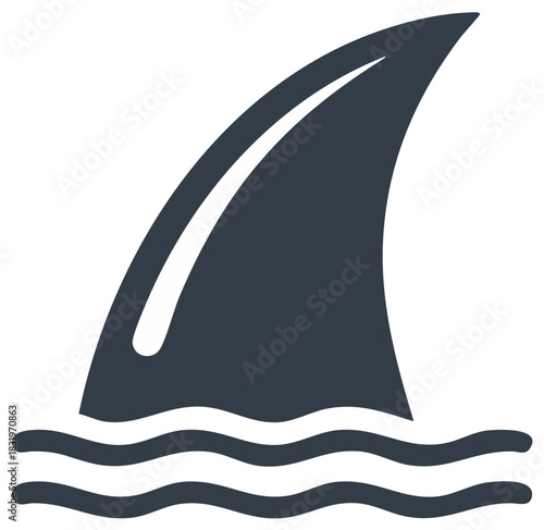 Shark fin piercing through water creating dangerous ripple effect in the ocean