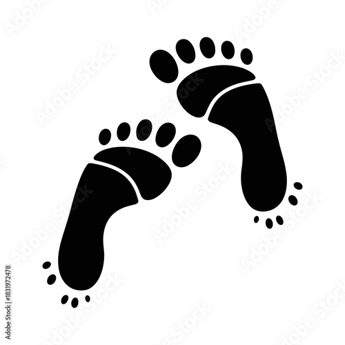 Two black footprints are walking on a white background, representing a journey and steps taken, isolated on white.