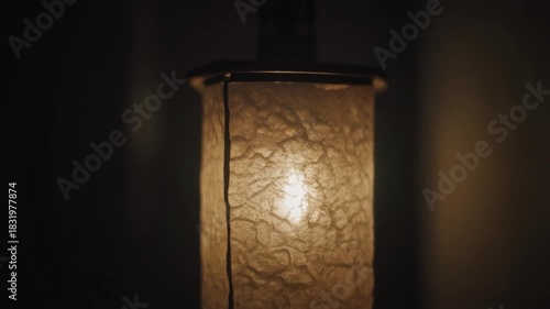 Glowing Lamp Shade Against Dark Backdrop Ambient Lighting and Artistic Design