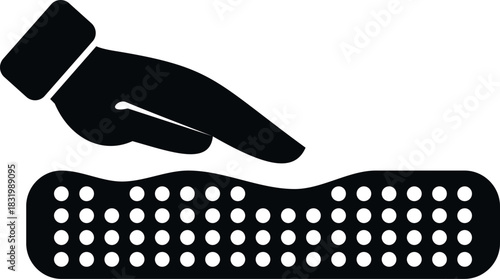 Hand pressing down on a mattress surface with pressure, creating an impression