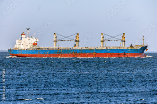 Germany, Elbe River Estuary. General Cargo ship entering the river Elbe mouth near Cuxhaven