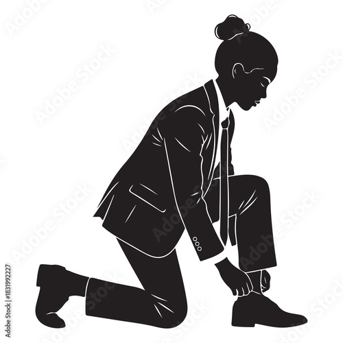 Silhouette of a businesswoman in a suit kneeling and tying her shoe with a determined expression on her face