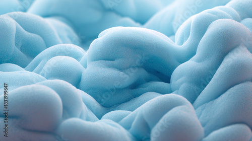 A close-up view of fluffy, abstract shapes with soft blue hues, resembling clouds