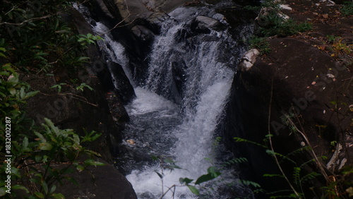 Splashing waterfall with large rocks