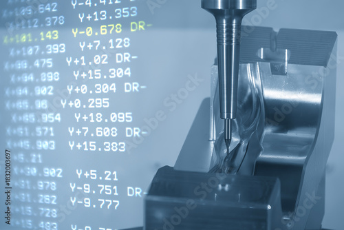 Abstract scene the CNC milling machine finish cut the mold parts and NC data background.