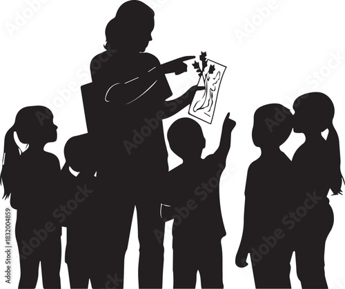 Teacher inspiring young children with educational activities and learning symbols