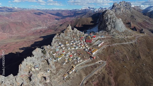 Aerial Drone View of Zizhu Monastery (Tsudrug temple) Nestled in Rocky Tibetan Mountains