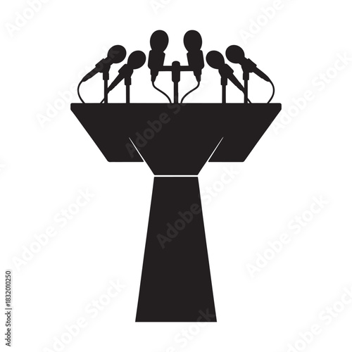 Press conference podium with multiple microphones silhouette