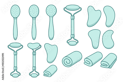 Collection of facial massage tools arranged neatly on a clean background, showcasing various styles and designs for skincare
