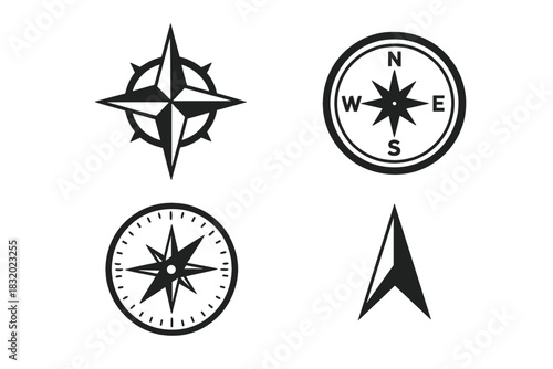 Different designs of compasses showcasing directional symbols and styles in black and white