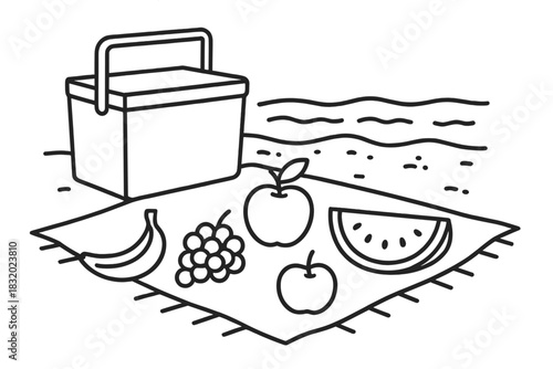 Picnic scene at the beach with fresh fruits and a cooler box on a sunny day
