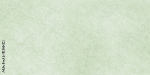 Polished natural granite marble for ceramic wall tiles. soft natural patterns, and a smooth polished stone surface. green paper texture. light green polished plaster rough concrete wall background.