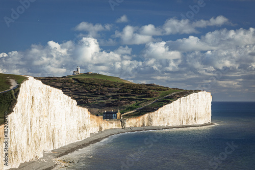View of Belle Tout lighthouse and Birling Gap from the cliff tops of the seven sisters on the east Sussex coast south east England UK