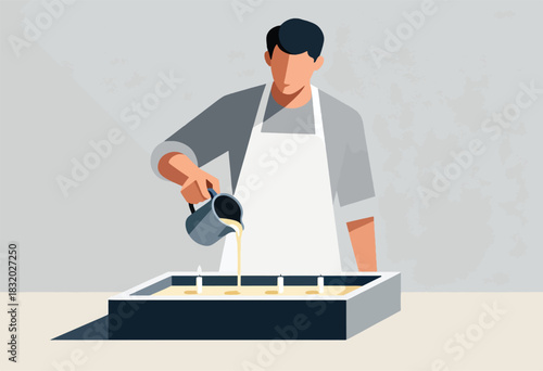 An individual in an apron pours liquid from a pitcher into a rectangular container with candle wicks