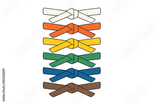 Different colored belts stacked in order demonstrating progression in martial arts training