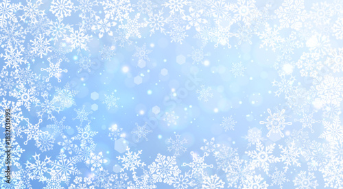 Intricate white snowflakes on a soft blue background with gentle sparkles