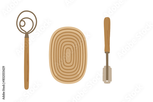 Kitchen utensils set including a whisk, a dough scraper, and a bread proofing basket on a clean surface