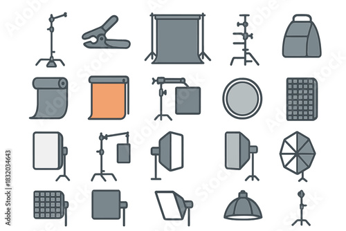 Photography equipment includes light stands, backdrops, reflectors, and other studio tools arranged neatly in a row