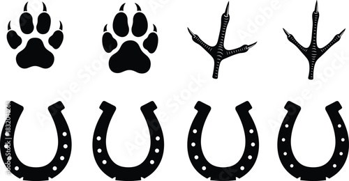 Black silhouettes of animal paw prints and horseshoes on white background animal track