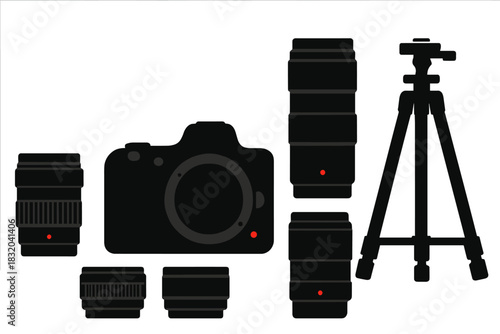 Camera equipment laid out for a photography session with various lenses and a tripod
