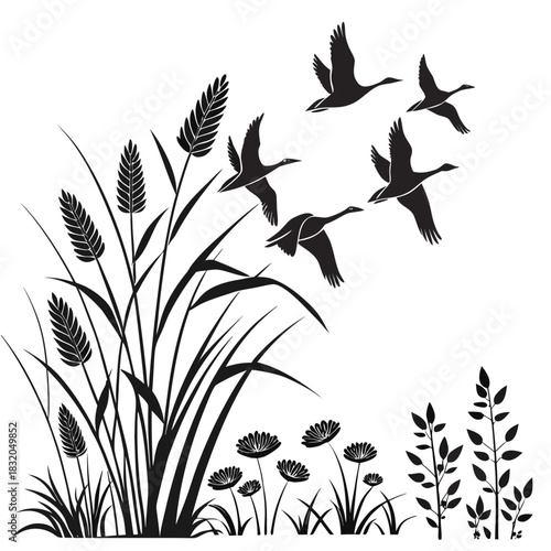 Flock of geese flying over reeds and wildflowers in silhouette