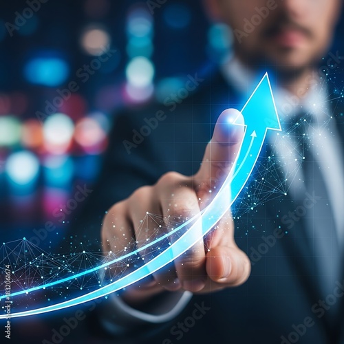 Businessman's finger pointing at a glowing blue arrow indicating growth and success image photo